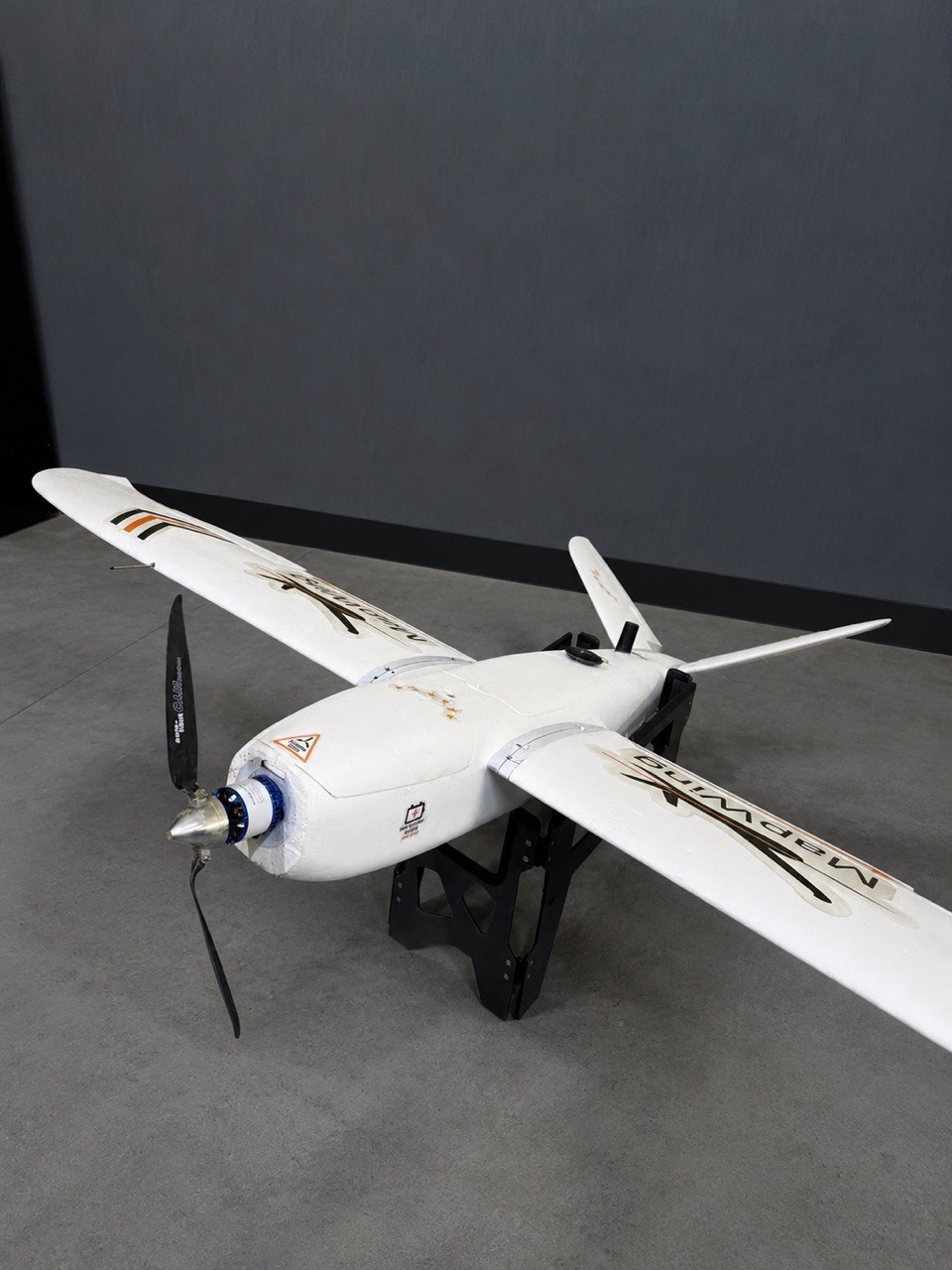 MapWing fixed-wing UAV studio view showing V-tail configuration